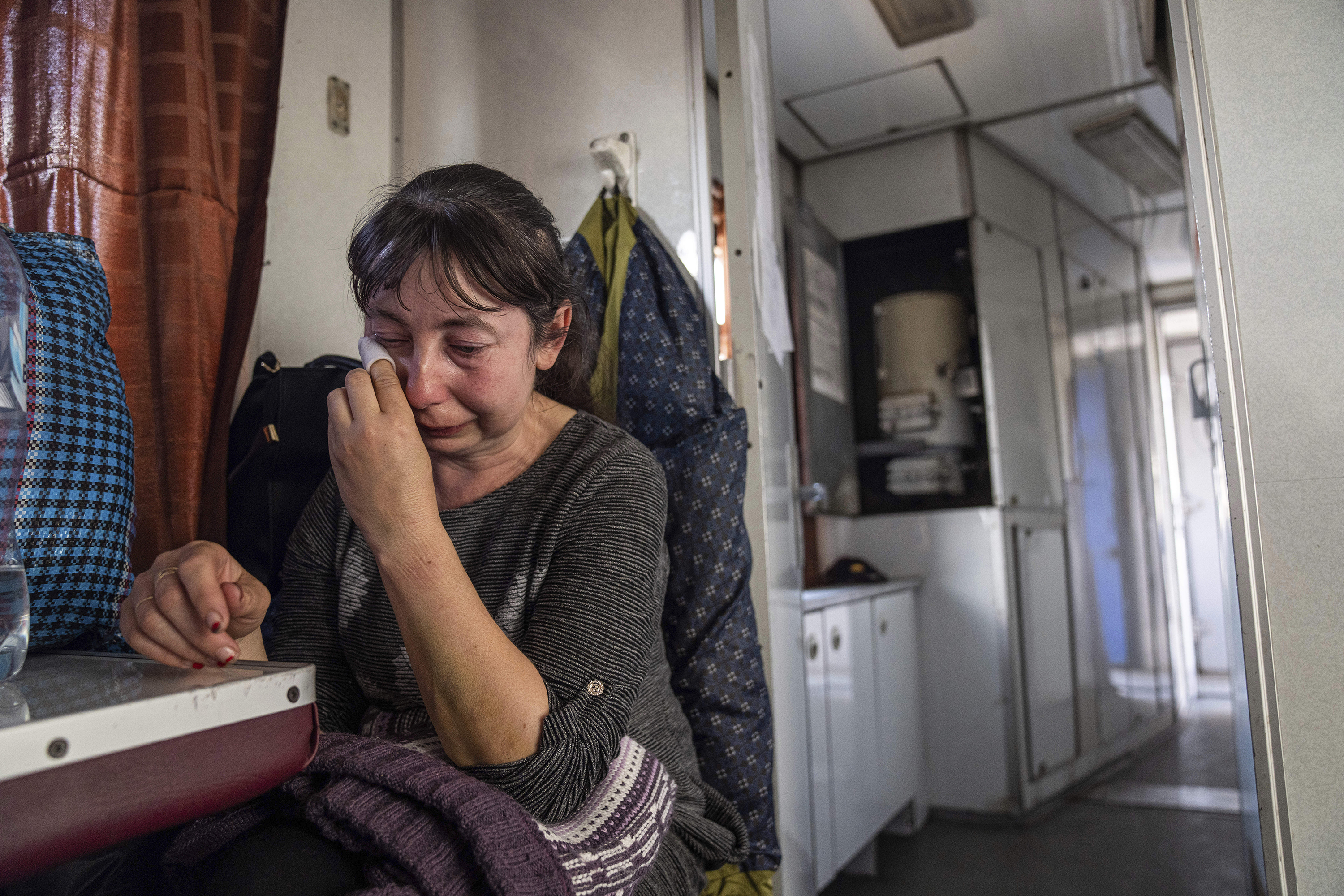 April 26: A woman from the Luhansk Oblast cries while sitting on an evacuation train in Pokrovsk, in eastern Ukraine.