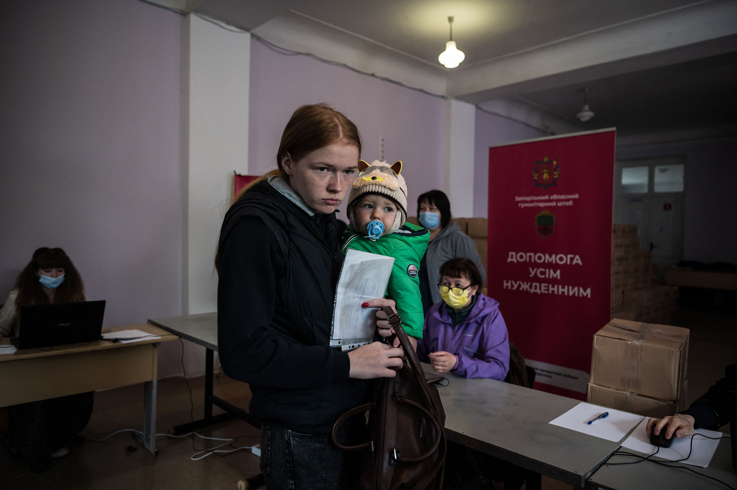 April 27: People queue at a food distribution center for internally displaced persons and others in need in Zaporizhzhia. Ukrainian officials said Russian forces had captured several eastern villages as part of Moscow's offensive to take control of the country's eastern Donbas region, which Russia has vowed to "liberate."