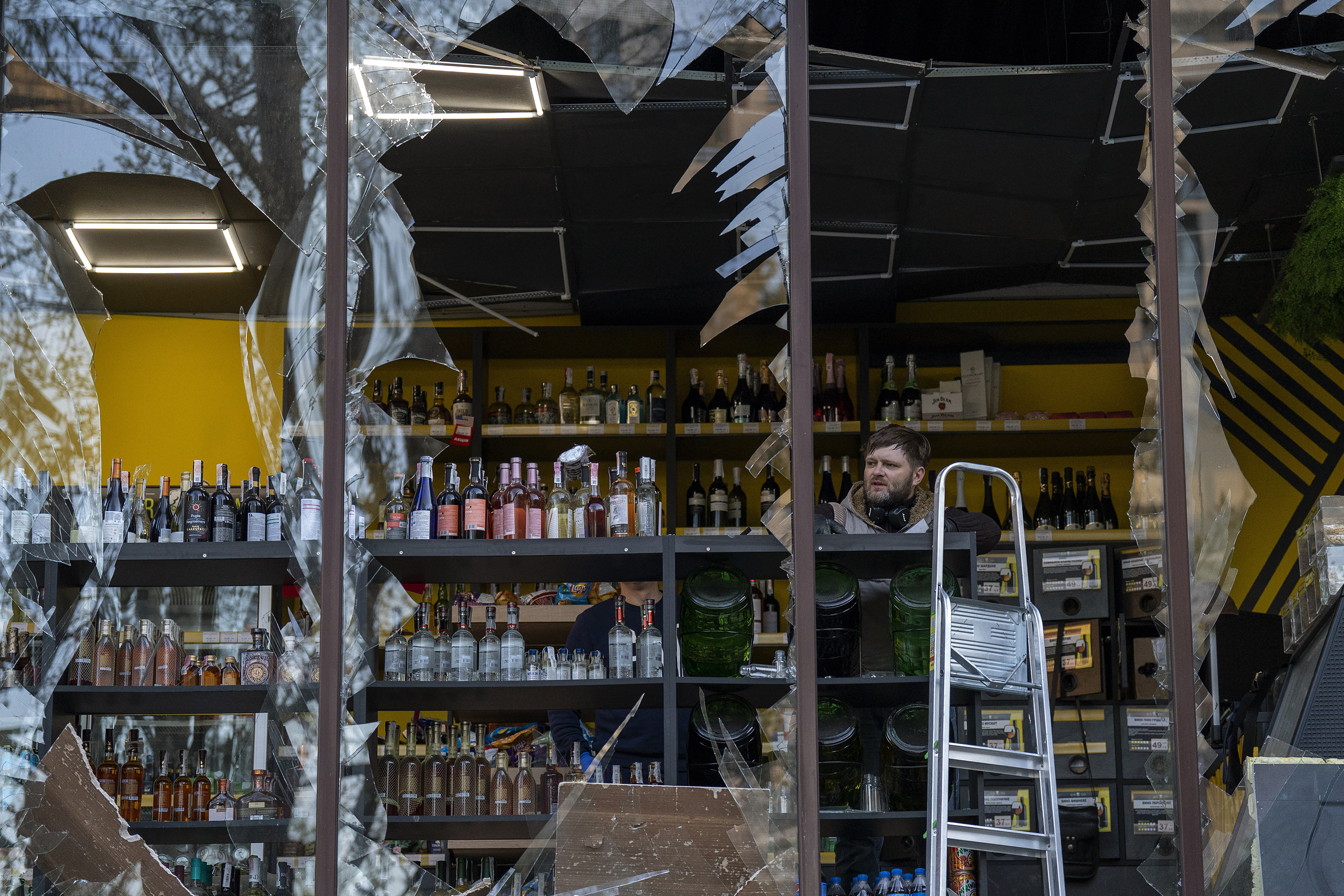 April 29: A liquor store owner looks at the damage to his shop caused by an explosion in Kyiv, Ukraine.