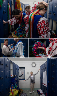 Members of the Voloshky dance ensemble dress up and practice their routine in the Penn High School locker room.