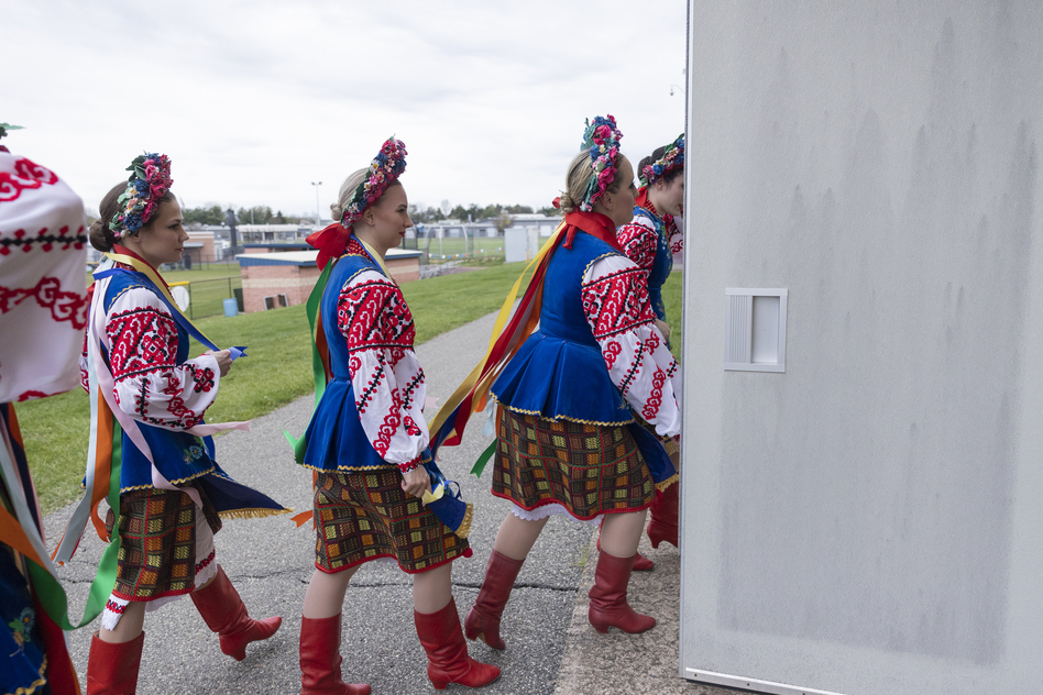 Members of the Ukrainian dance ensemble Voloshky arrive for their final dance number.