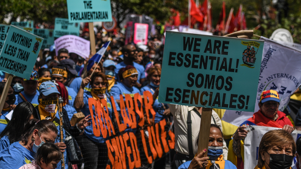 Workers participate in a May Day rally in New York City. Amazon workers recently unionized a facility in Staten Island, emboldening other workers to push for their companies to unionize.