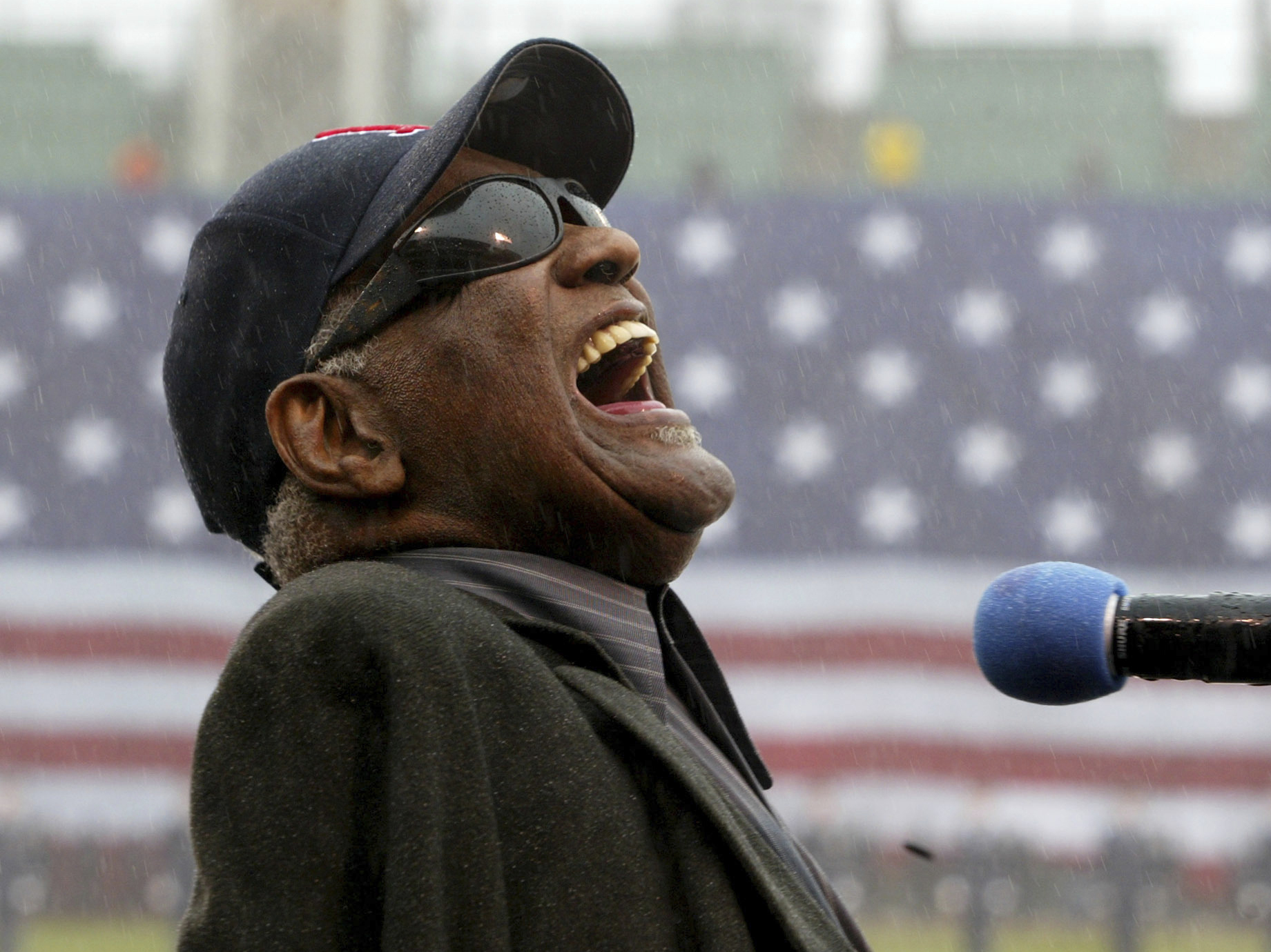 Ray Charles sings "America The Beautiful," in the rain at Fenway Park in Boston, April 11, 2003. Charles was posthumously inducted into the Country Music Hall of Fame on Sunday, May 1, 2022, in Nashville, Tenn., along with The Judds.