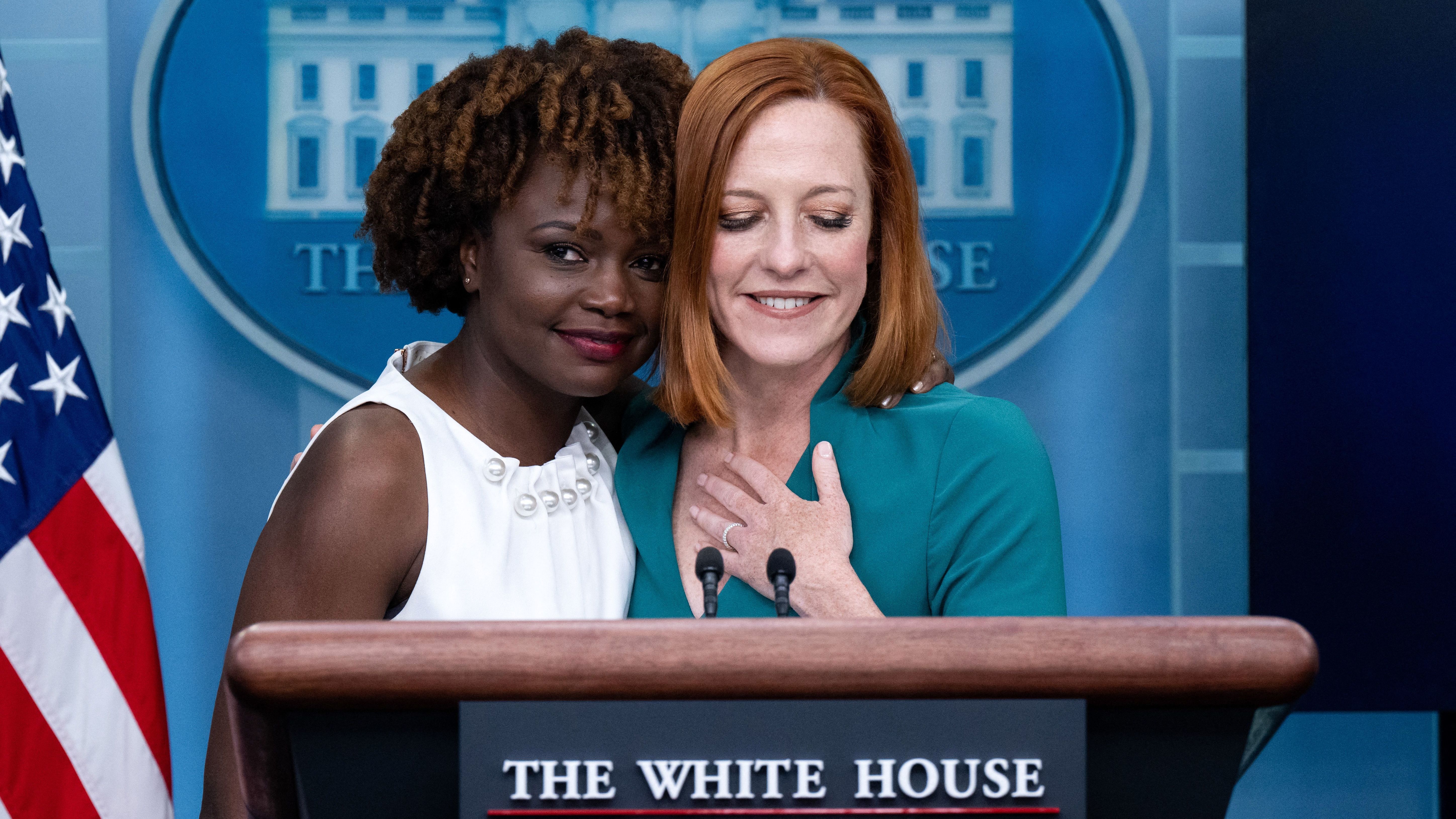 White House Press Secretary Jen Psaki is hugged by current Principal Deputy Press Secretary Karine Jean-Pierre during a press briefing at the White House on Thursday after it was announced Psaki would step down from her role next week and be replaced by Jean-Pierre.