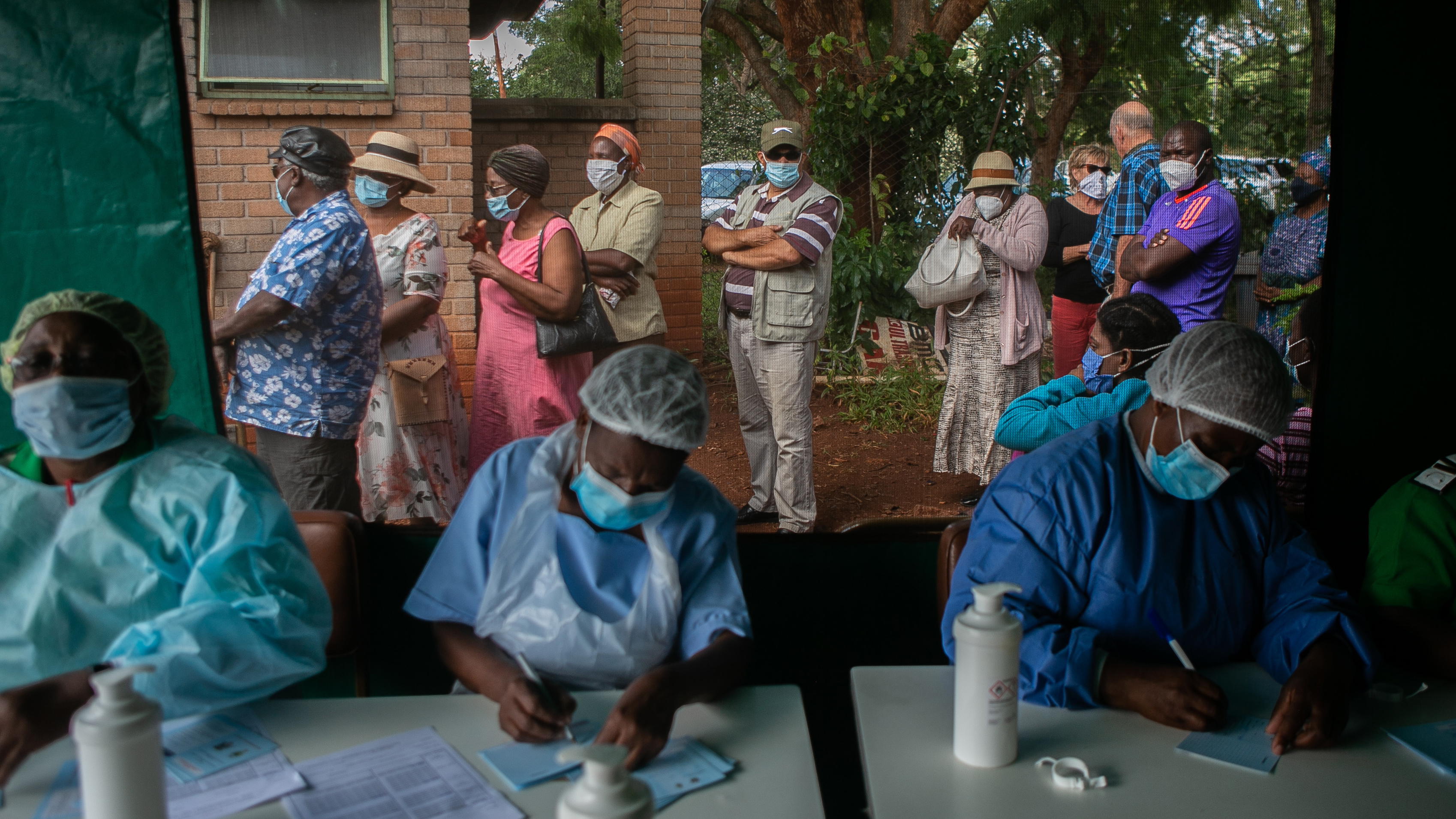 People line up to get the Sinopharm vaccine in Harare, Zimbabwe. World leaders promised to speed up vaccine distribution to low- and middle-income countries at the White House