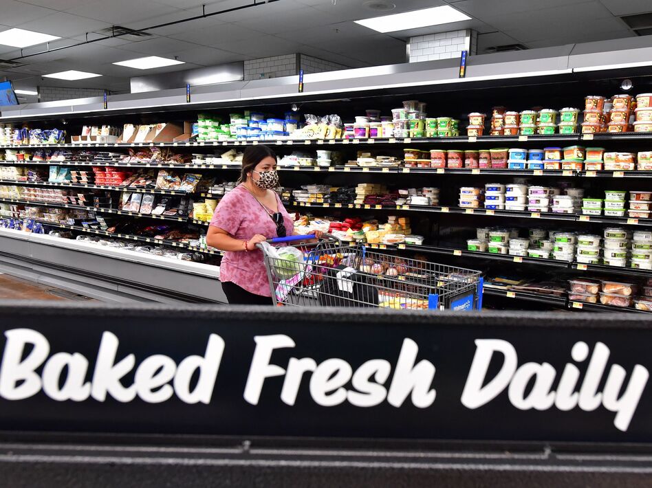 A person shops for groceries in Rosemead, Calif., on April 21. Annual inflation remains at its highest in decades as costs across the board have surged.
