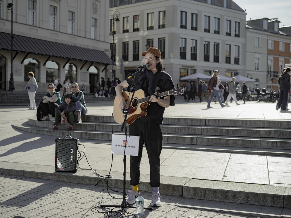 Roman Panchenko, from Chernihiv, performs in Castle Square in Warsaw, Poland, on Tuesday.