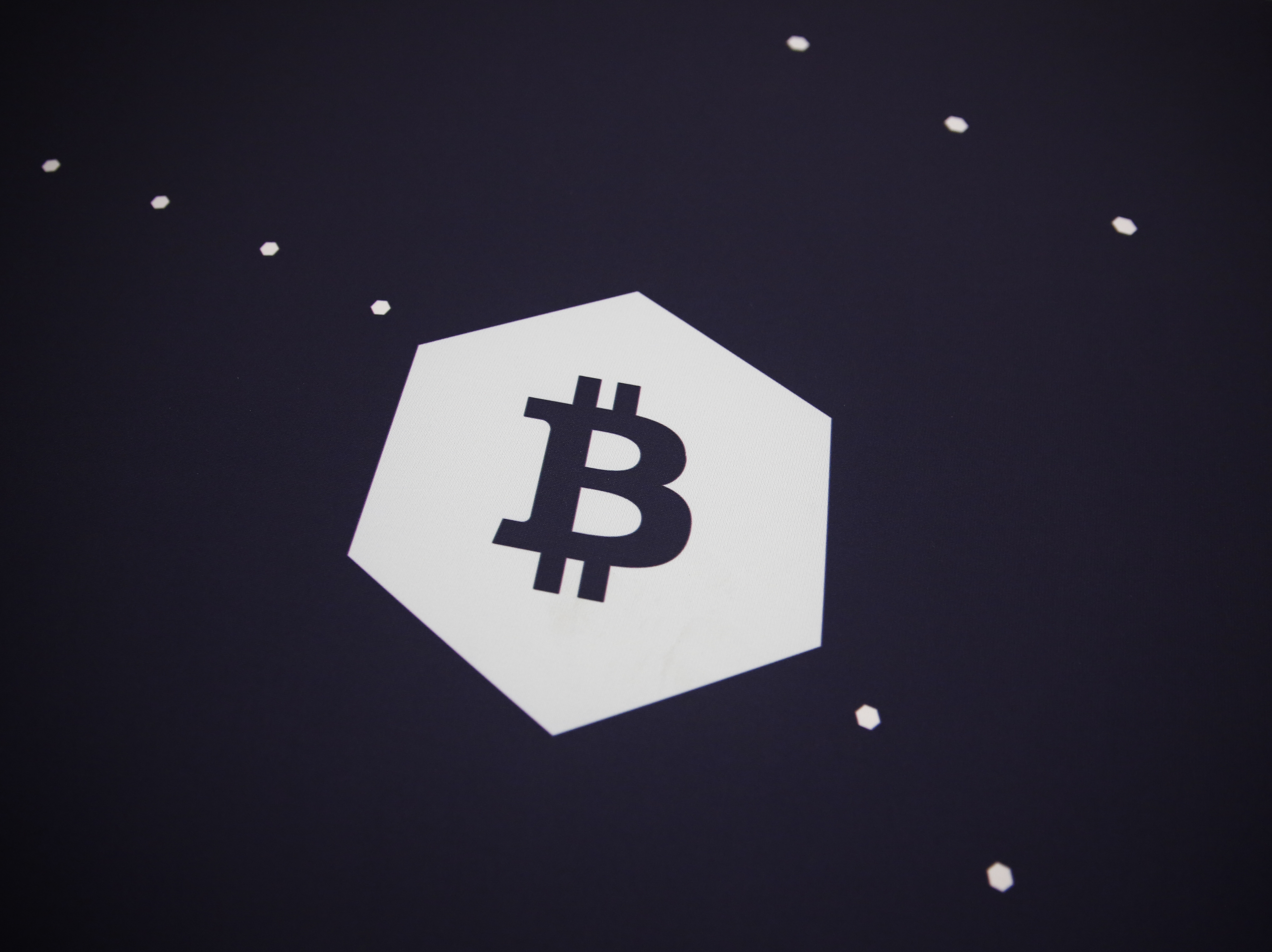 A Bitcoin logo is seen during the Bitcoin 2022 Conference at Miami Beach Convention Center in Miami on April 8. Crypto such as Bitcoin have tumbled in recent days as part of a storm hitting all kinds of markets. (Getty Images)