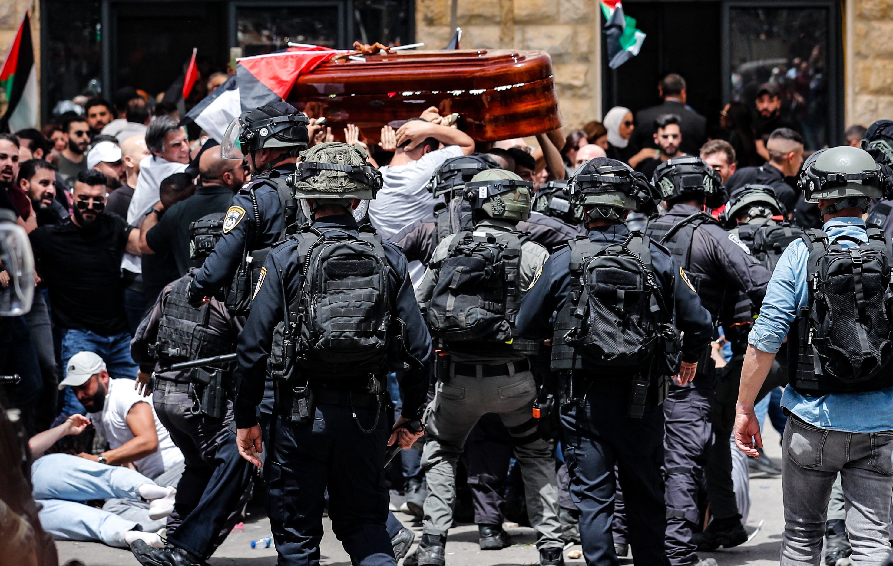 Israel's police chief orders an investigation into officers' conduct during Friday's funeral of Al Jazeera journalist Shireen Abu Akleh, who was killed while covering an Israeli arrest raid in a Palestinian refugee camp. (AFP via Getty Images)