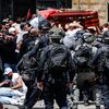 Israeli police investigate officers' use of force at a veteran journalist's funeral