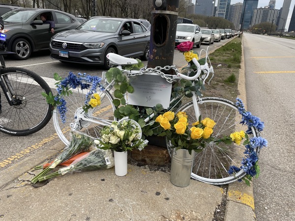 Cycling advocates and the family of Gerardo Marciales chained a ghost bike at an intersection on Dusable Lake Shore Drive in Chicago, where Marciales was hit and killed by a driver who ran a red light. Advocates say the intersection's poor design contributed to the collision.