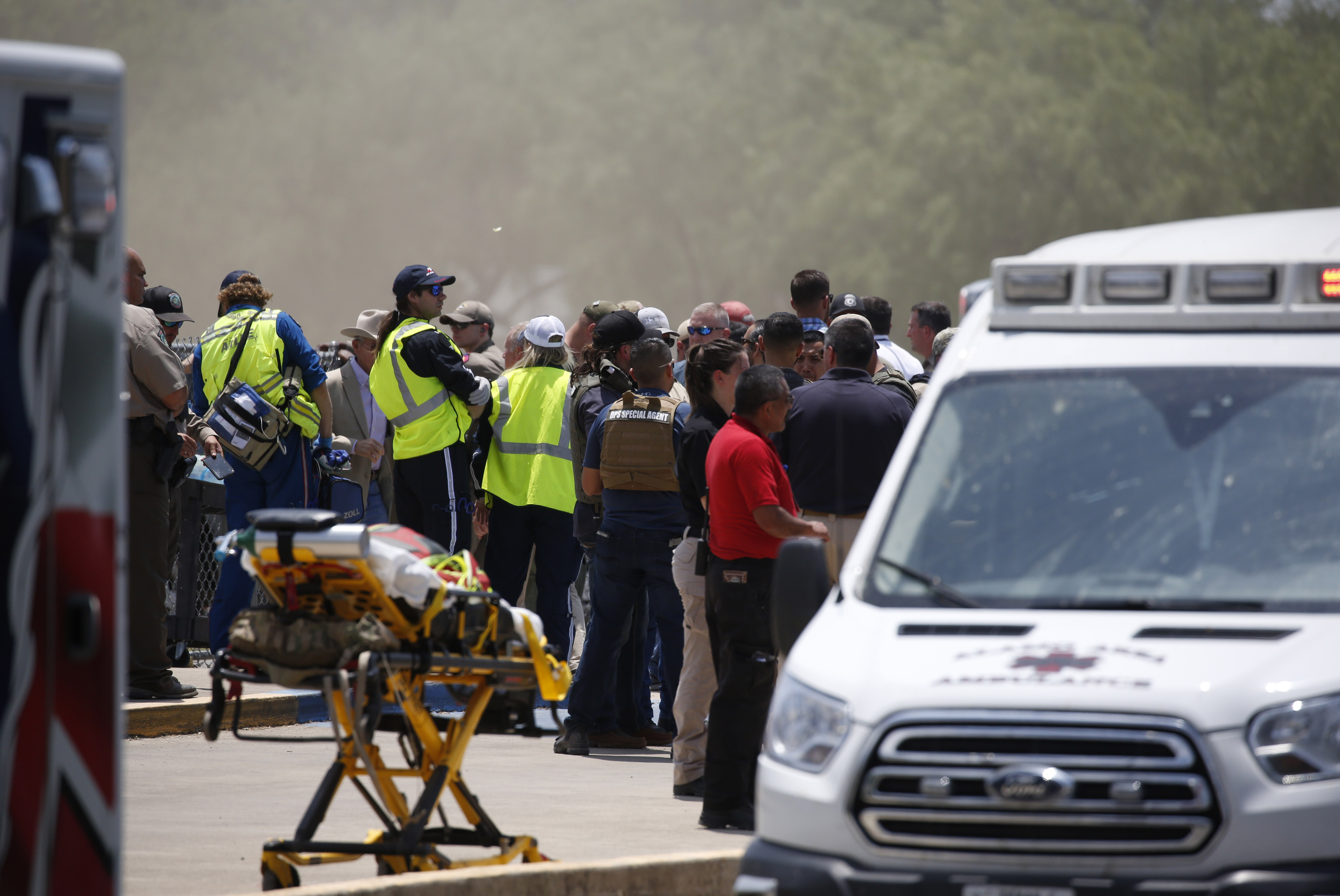 May 24: Emergency personnel gather near Robb Elementary School following the shooting.