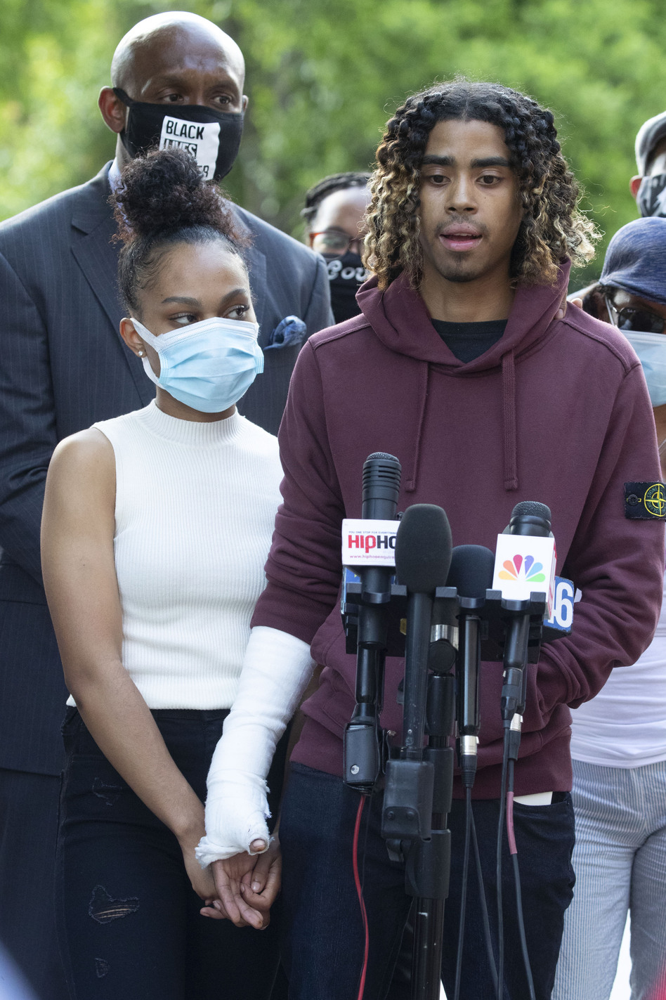 Taniyah Pilgrim and Messiah Young address the press at Morehouse College in Atlanta. Prosecutors filed charges against six officers involved in the couple's arrest. (John Bazemore/AP)