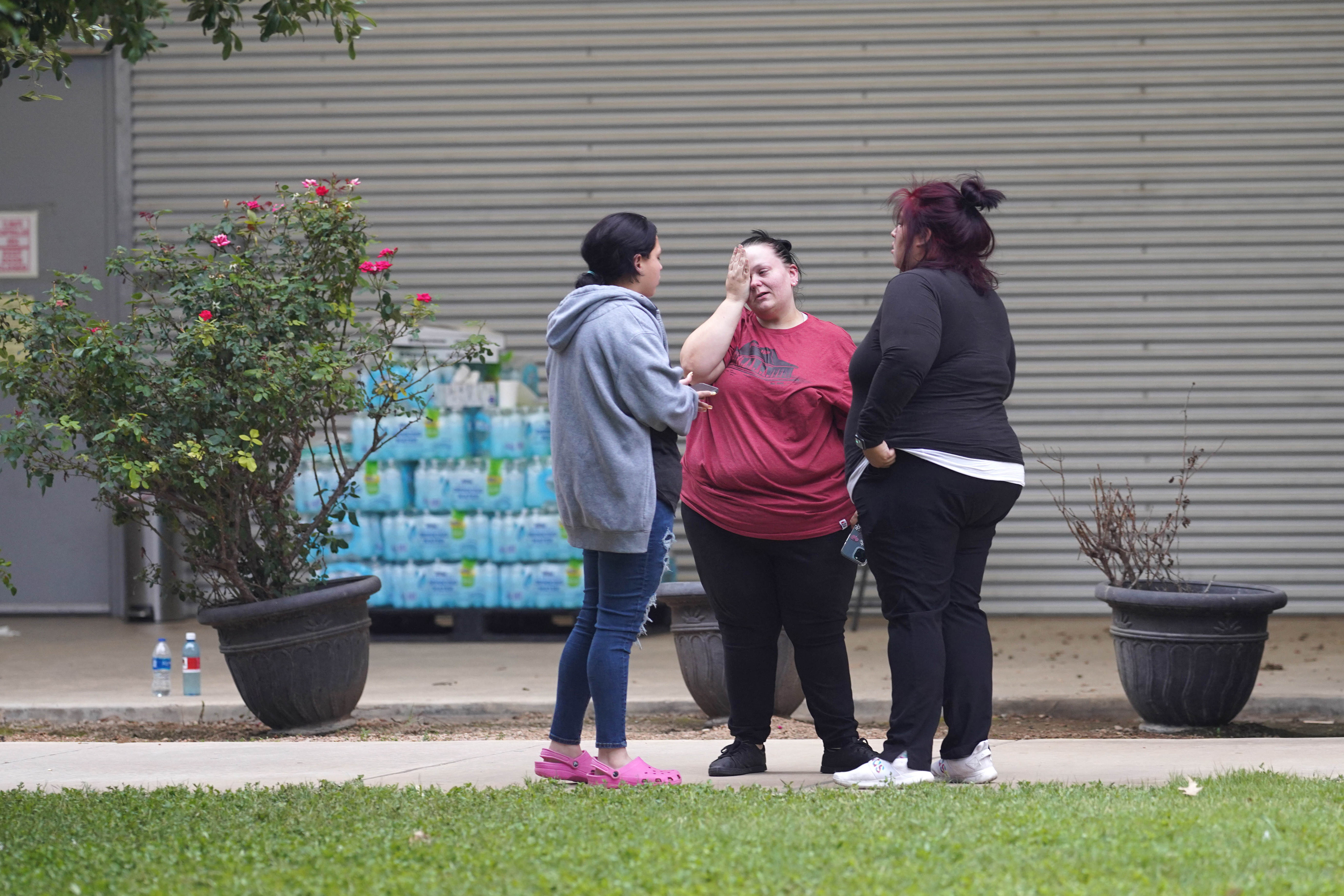 May 24: Friends and families gather in mourning outside the Willie de Leon Civic Center where grief counseling will be offered.