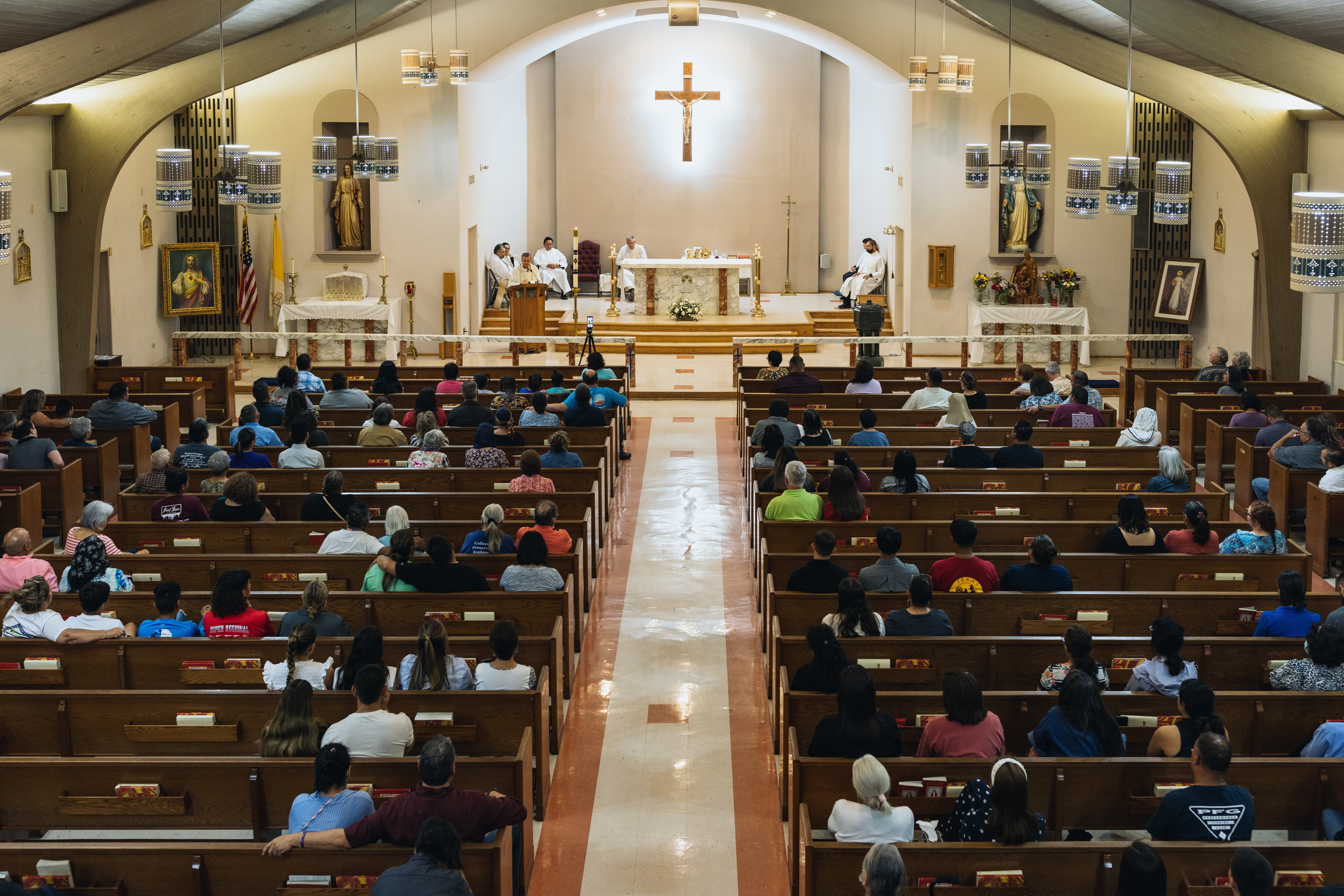 May 24: Mourners attend a vigil at Sacred Heart Catholic Church for victims of a mass shooting at Robb Elementary School.