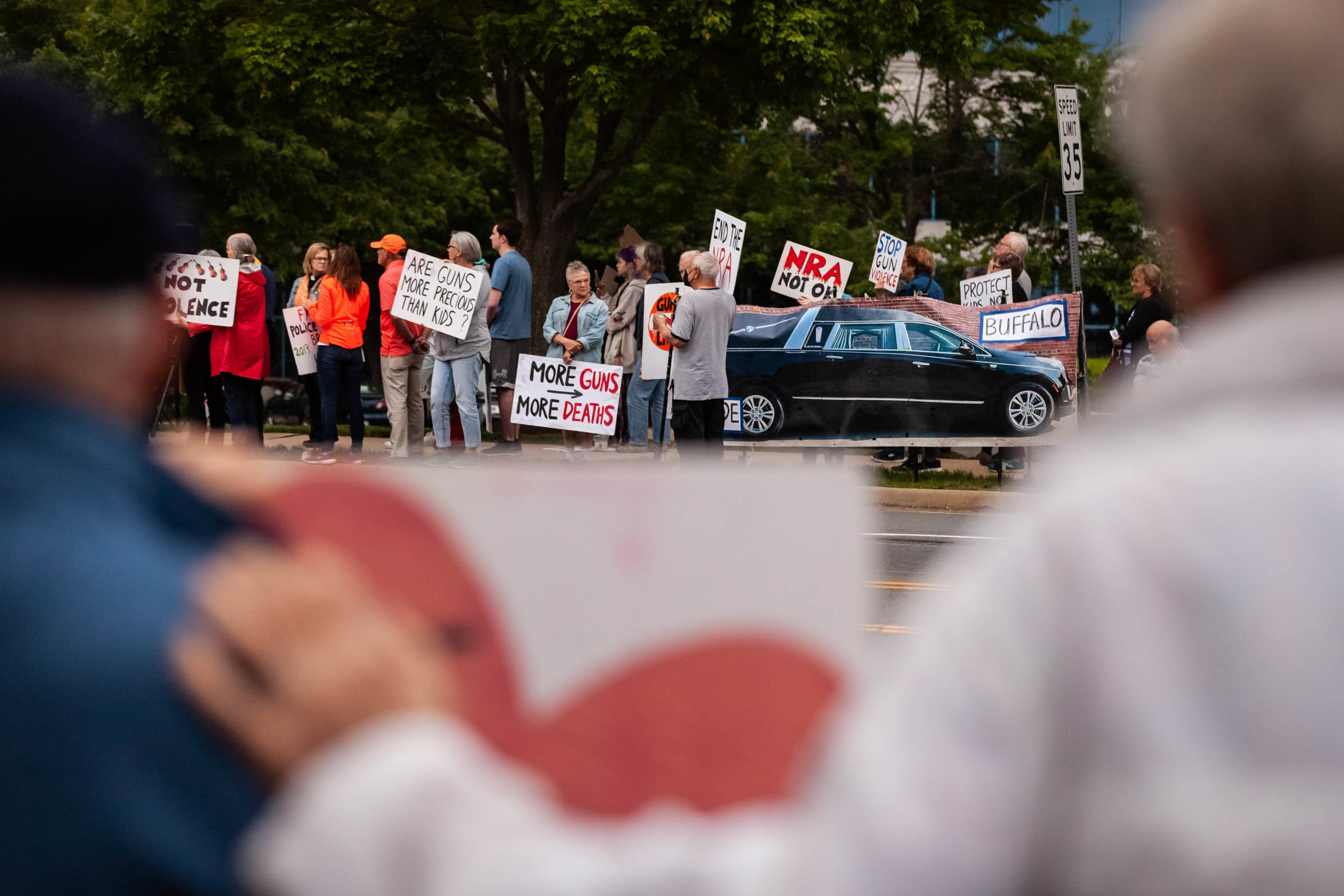 Demonstrators attend a candlelight vigil Wednesday in Fairfax, Va., for the victims of the Uvalde and Buffalo mass shootings. (Reuters Connect)