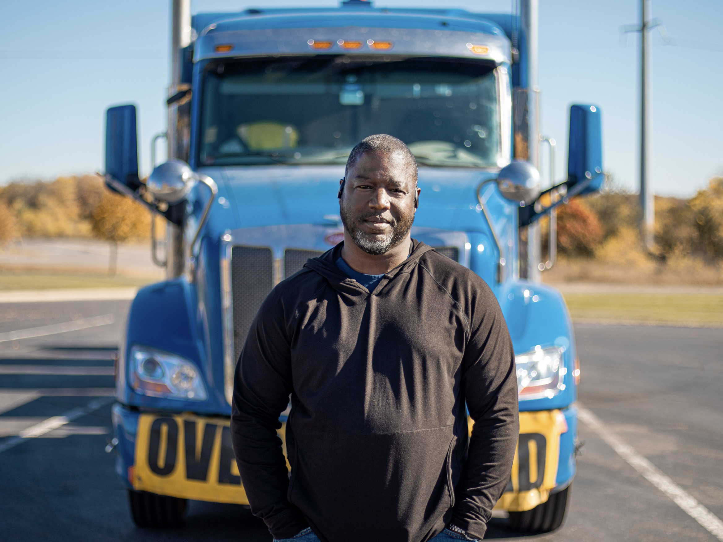 Heavy haul trucker Eric Jammer stands in front of his truck. (Anderson Trucking Service)