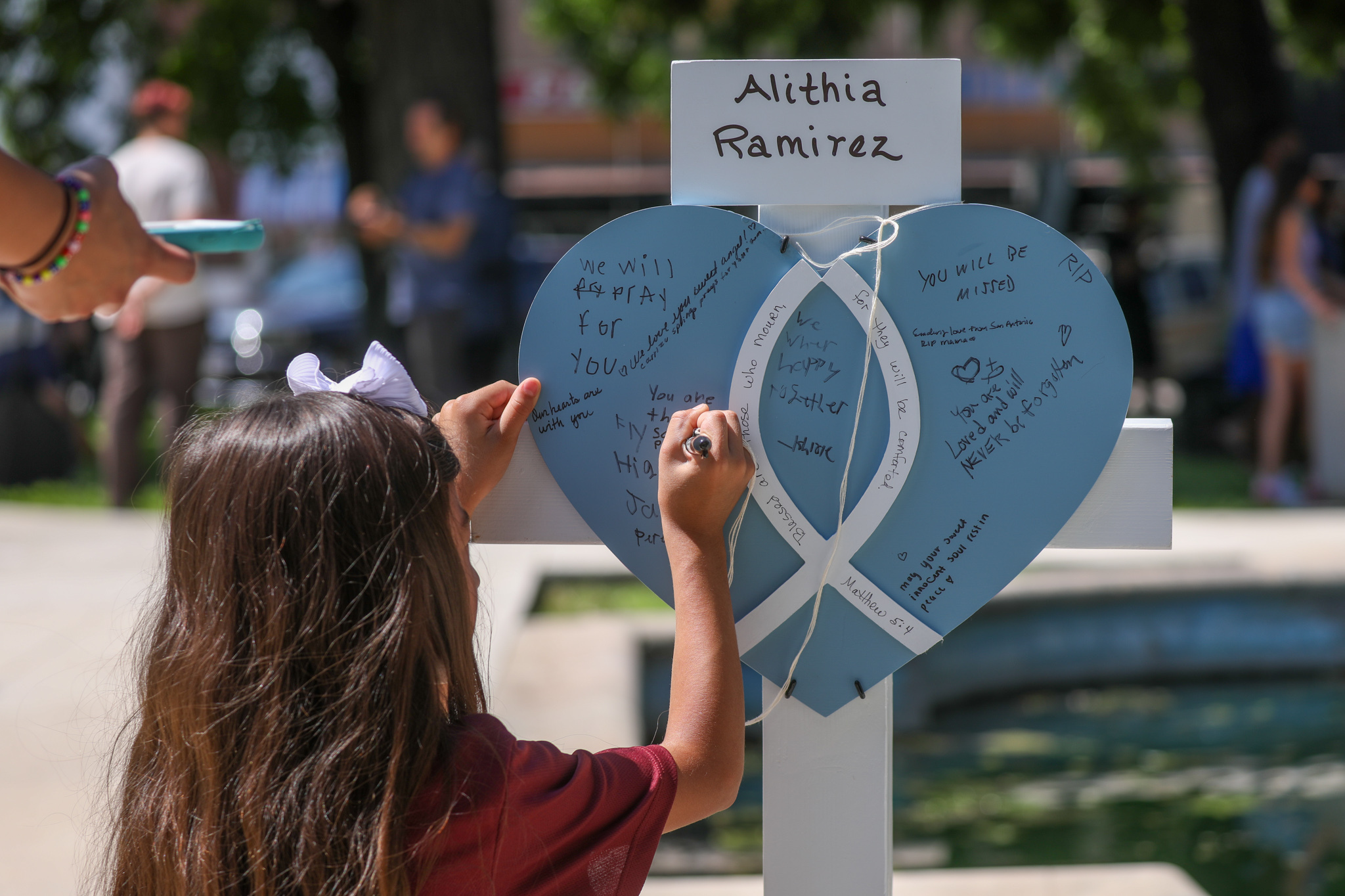 May 26: Mourners visit a memorial for a victims of Tuesday's mass shooting at an elementary school, in City of Uvalde Town Square.