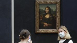 A man in a wig was detained after throwing a piece of cake at the Mona Lisa