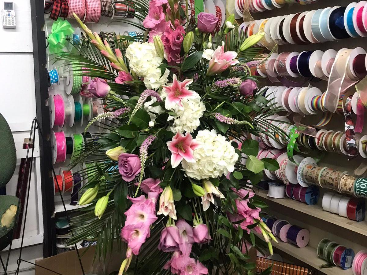 A floral arrangement honors a victim of the school shooting in Uvalde, Texas. (NPR)