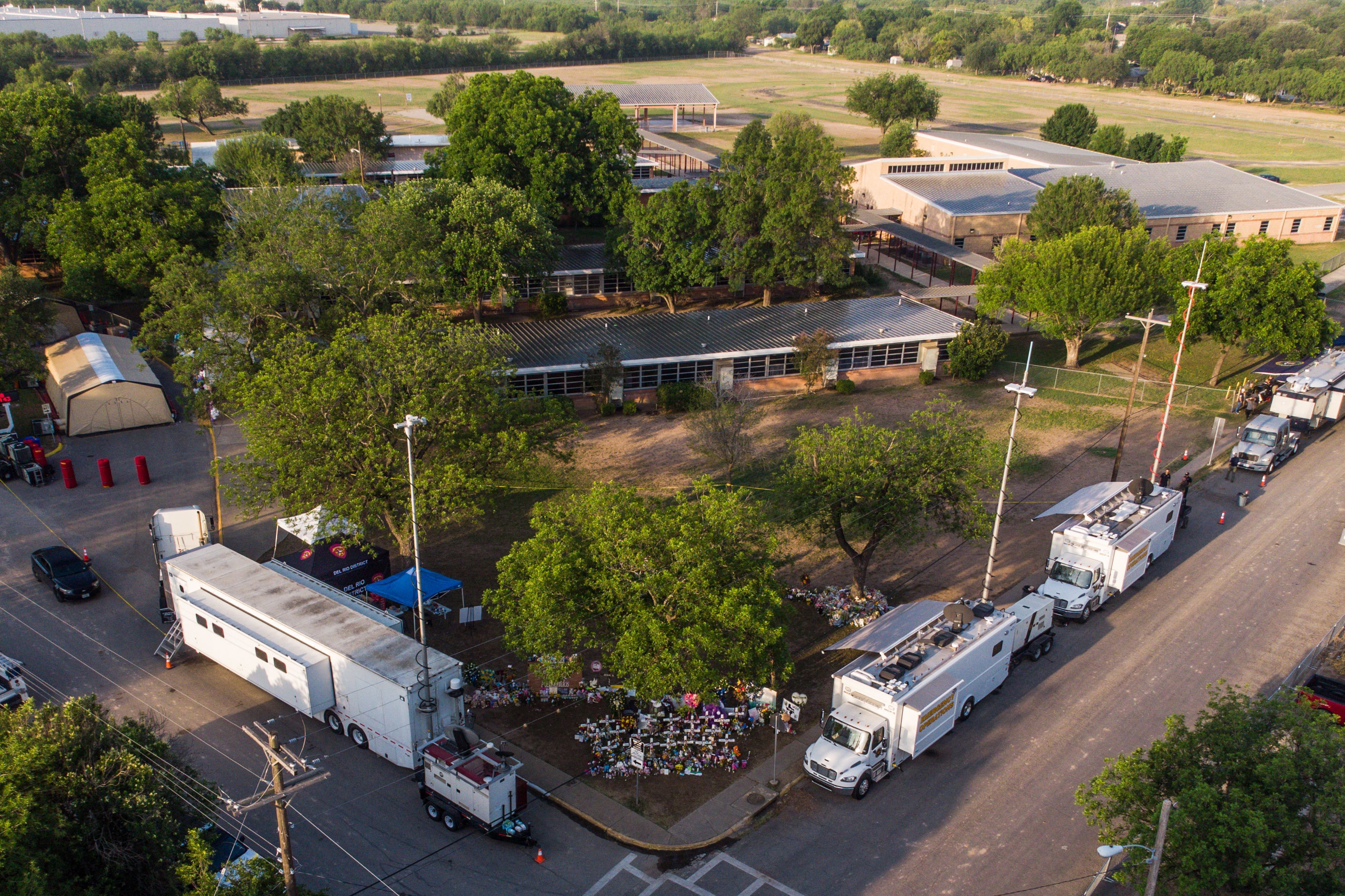 An aerial view of Robb Elementary School and the makeshift memorial for the shooting victims in Uvalde. (AFP via Getty Images)