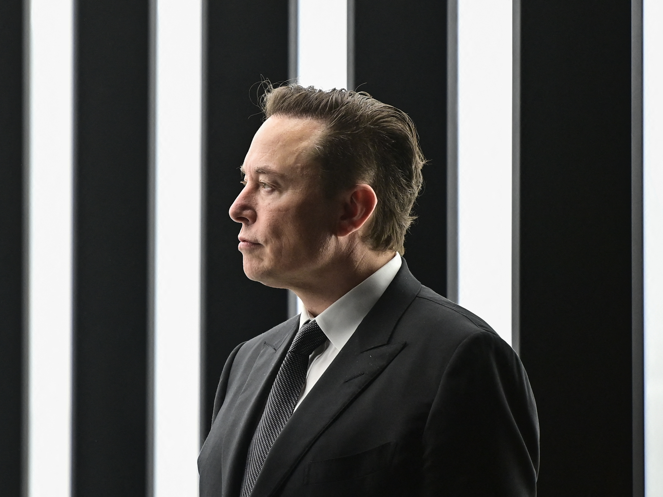 Tesla CEO Elon Musk attends the start of production at Tesla's &quot;Gigafactory&quot; in Grünheide, southeast of Berlin, Germany, on March 22. The billionaire, who has run afoul of regulators before, is in their sights again as he tries to buy Twitter. It's raising questions about the Securities and Exchange Commission's ability to police the rich and powerful. (Pool/AFP via Getty Images)