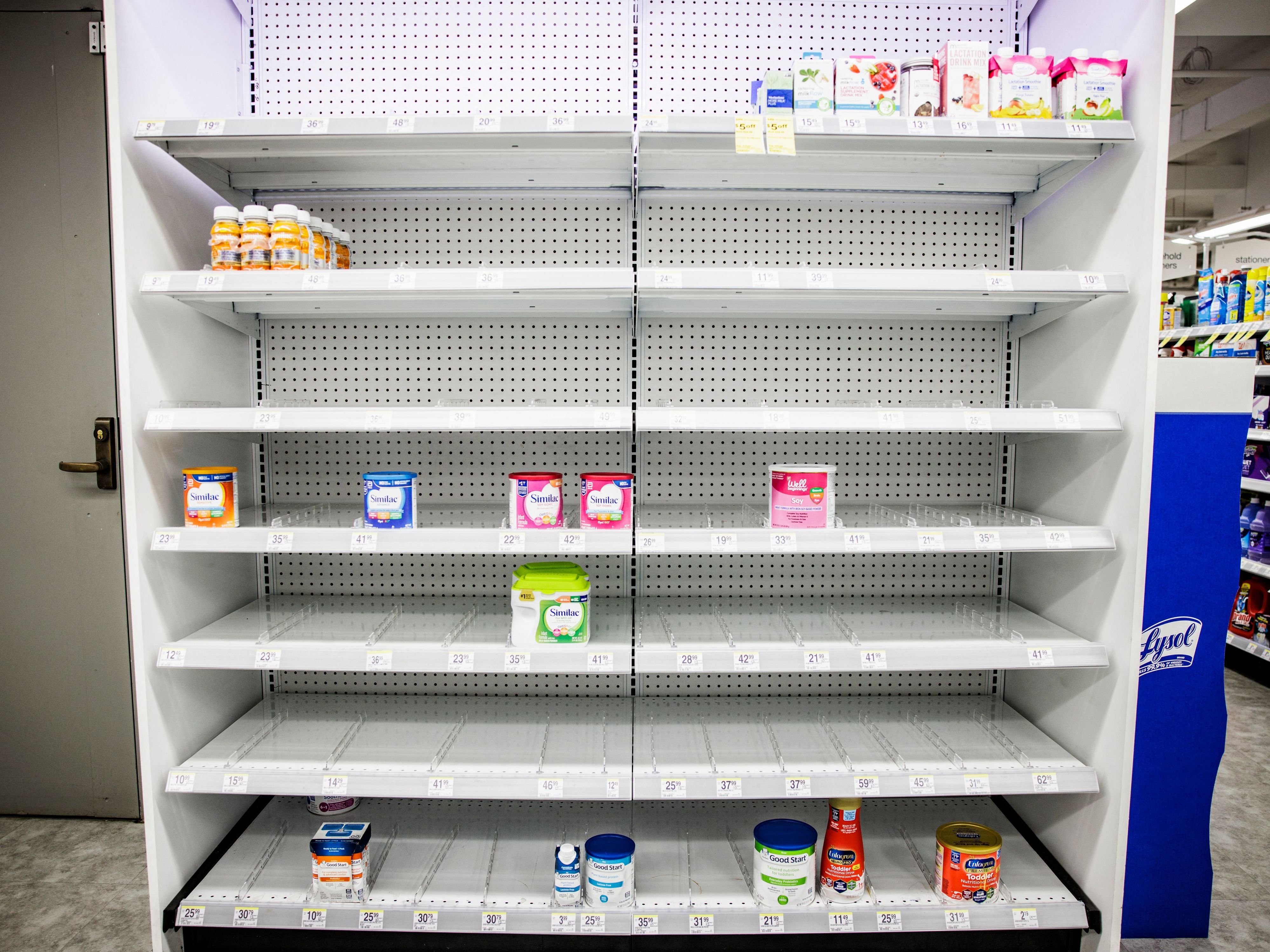 Shelves normally meant for baby formula sit nearly empty at a store in downtown Washington, D.C., on May 22. (AFP via Getty Images)