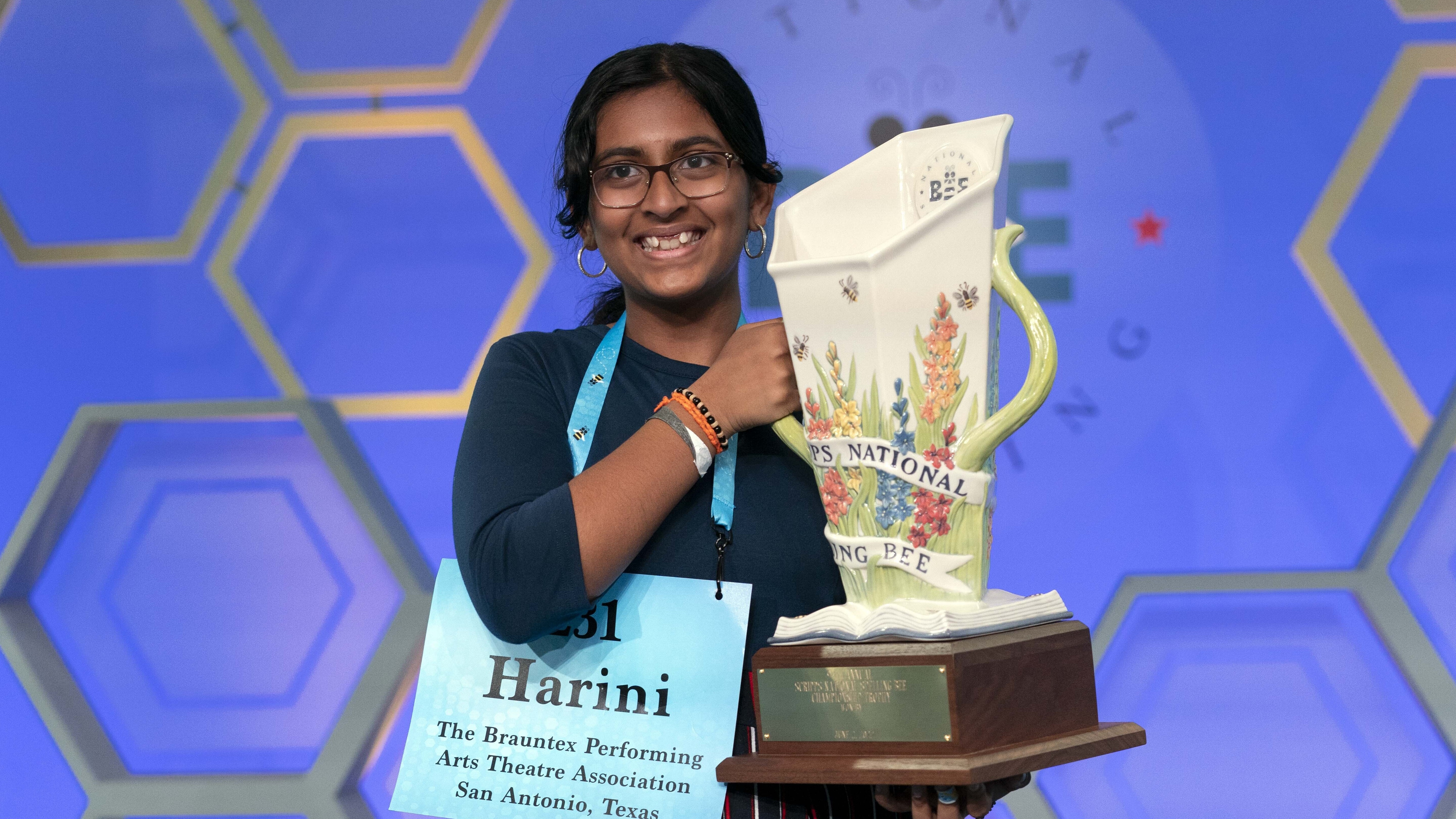 Harini Logan, 14, from San Antonio, Texas, holds her winning Scripps National Spelling Bee trophy, Thursday, June 2, 2022, in Oxon Hill, Md.