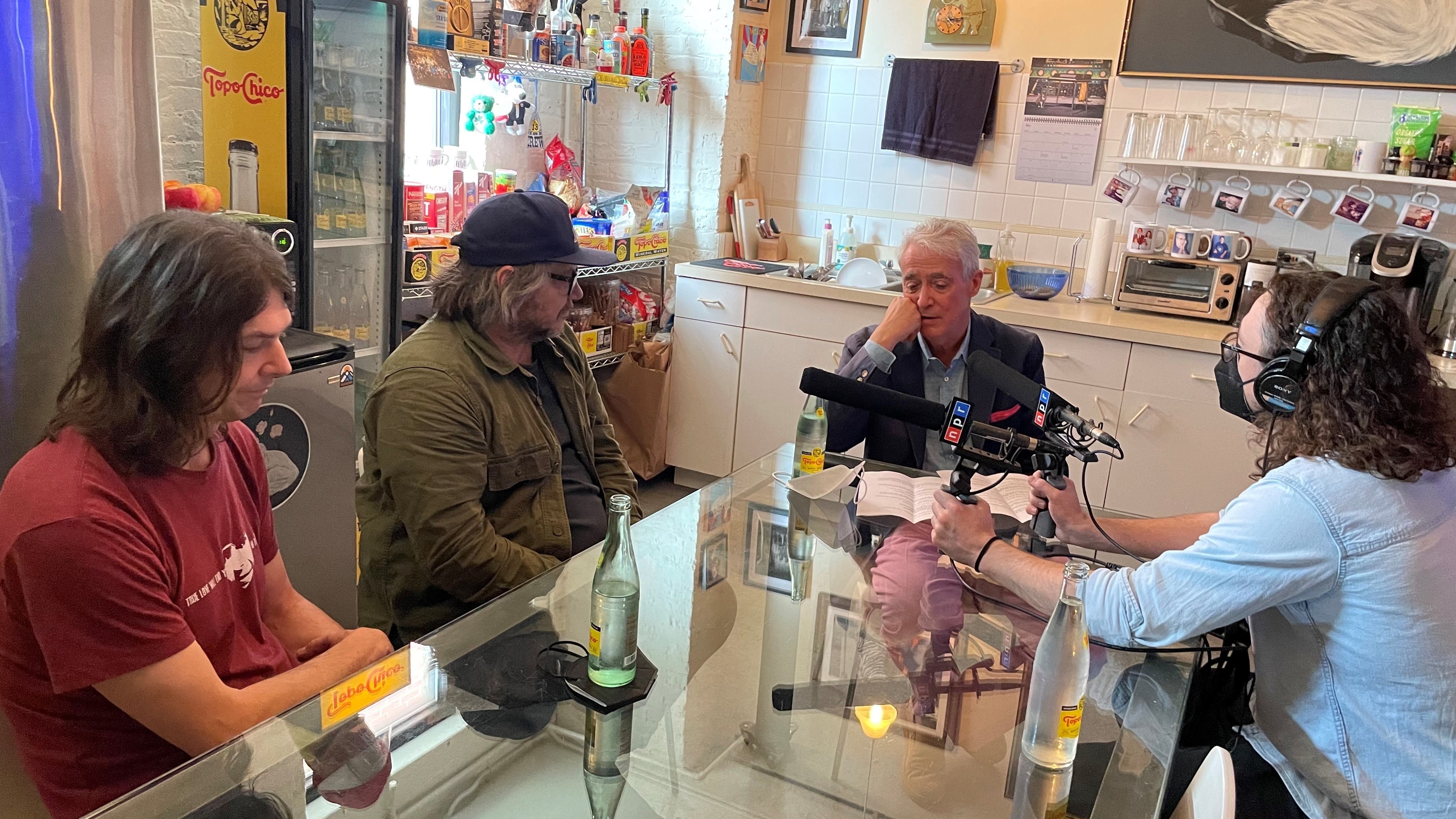 NPR's Scott Simon (center) and Weekend Edition producer Michael Radcliffe (right) talk Cruel Country with Wilco in their Chicago studio.
