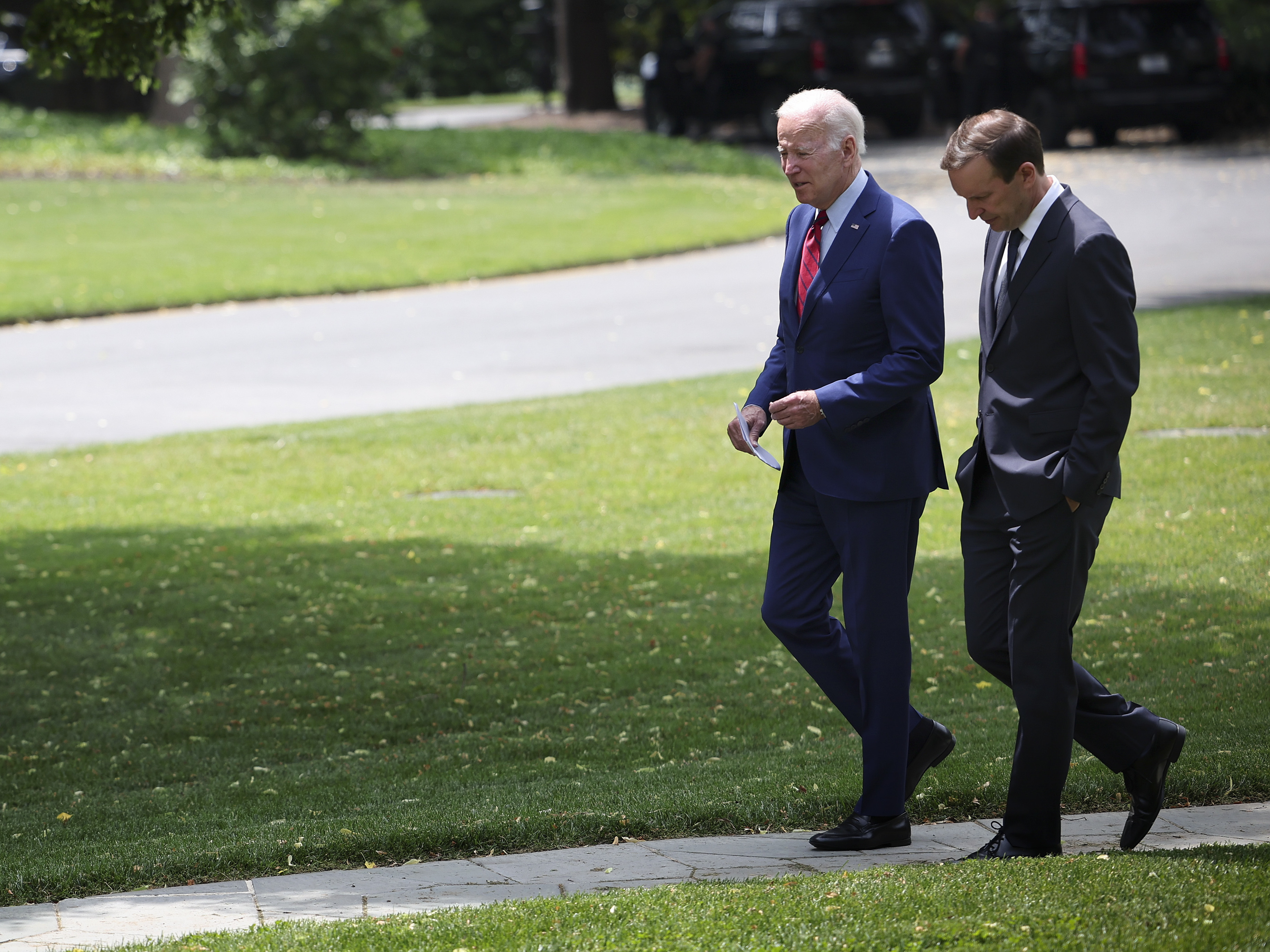 President Biden, left, talks with Sen. Chris Murphy, D-Conn., outside the Oval Office of the White House on Tuesday as the two discuss ongoing negotiations in the Senate around gun law legislation. (Getty Images)