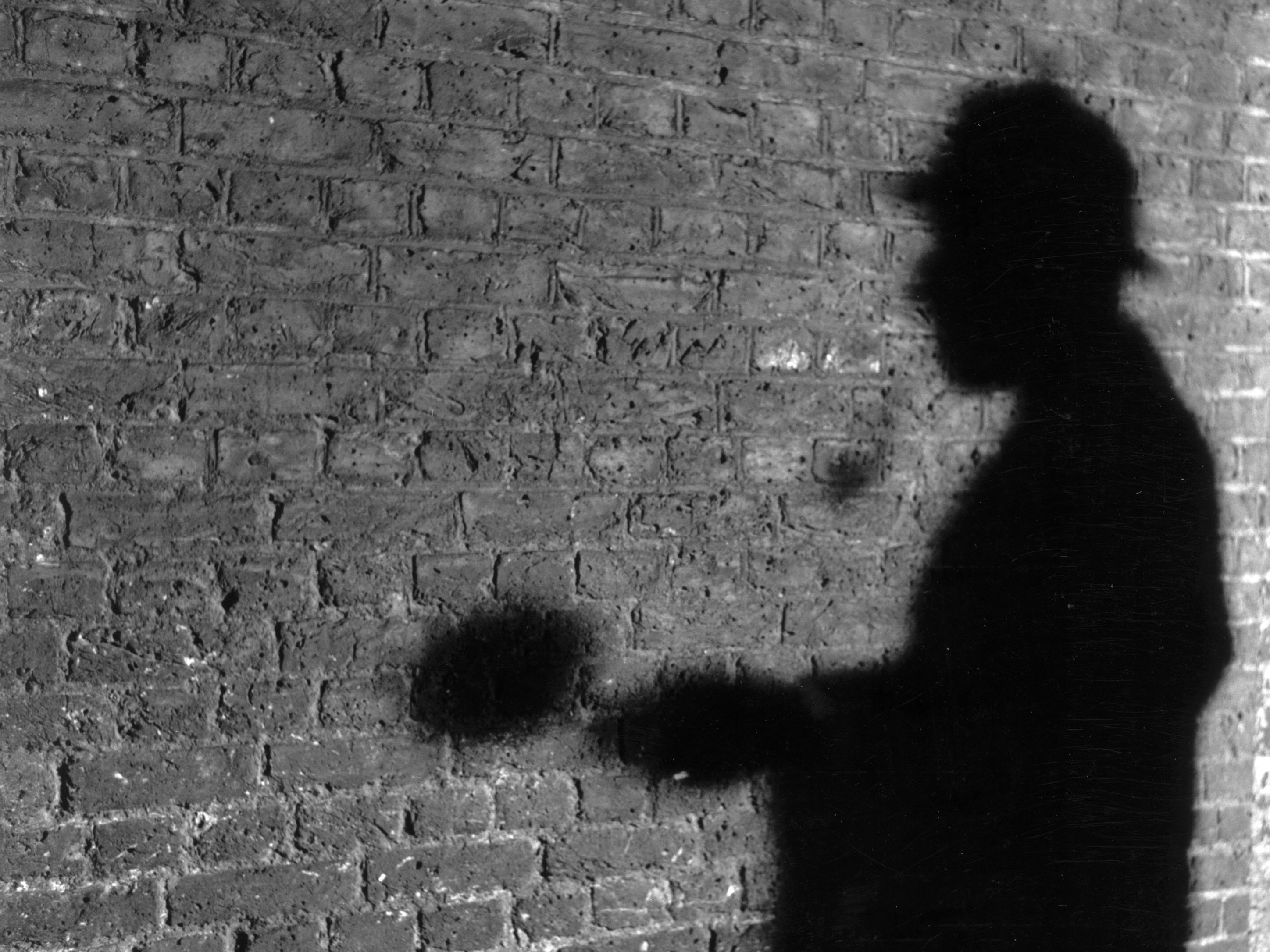 February 1968: The shadow of Abbey National Building Society publicity manager RA Rendel, posing as fictional detective Sherlock Holmes. Mr Rendel responded to fan mail sent to Holmes' address, 221b Baker Street, which is now used by the building society. (Photo by Peter Ruck/BIPs/Getty Images)