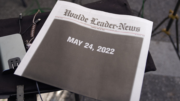 The front page of the local newspaper is seen in the media area outside Robb Elementary School in Uvalde, Texas, on May 26.