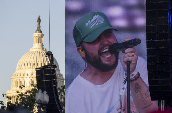 Quinn XCII is displayed on a large monitor with the U.S. Capitol in the background as he performs Friday, June 17.