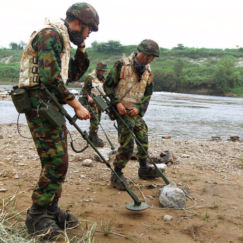 South Korean Army soldiers search for landmines in 2010 near the demilitarized zone that separates the two Koreas in Yeoncheon, north of Seoul, South Korea.