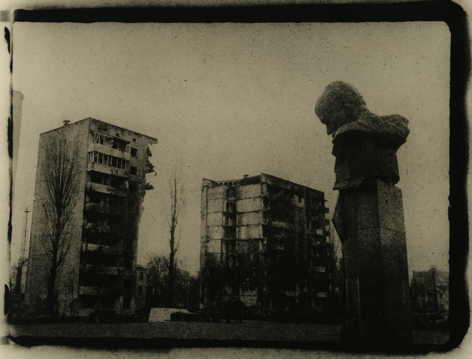 A monument to the poet Taras Shevchenko sits in front of ruined buildings in the city of Borodyanka, Ukraine, in March.