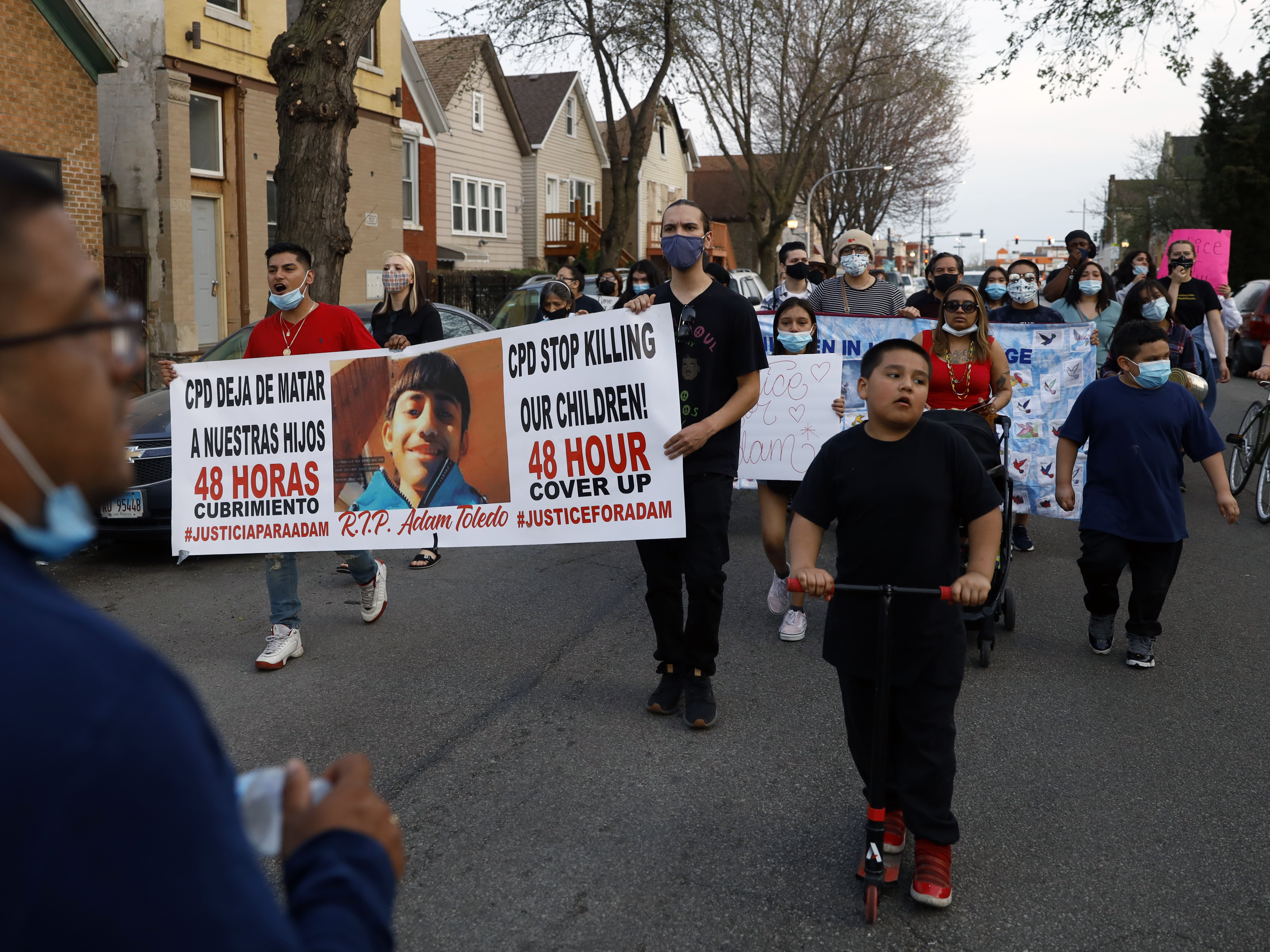 In this April 6, 2021 file photo, members of Chicago's Little Village Community Council march to protest against the death of 13-year-old Adam Toledo.
