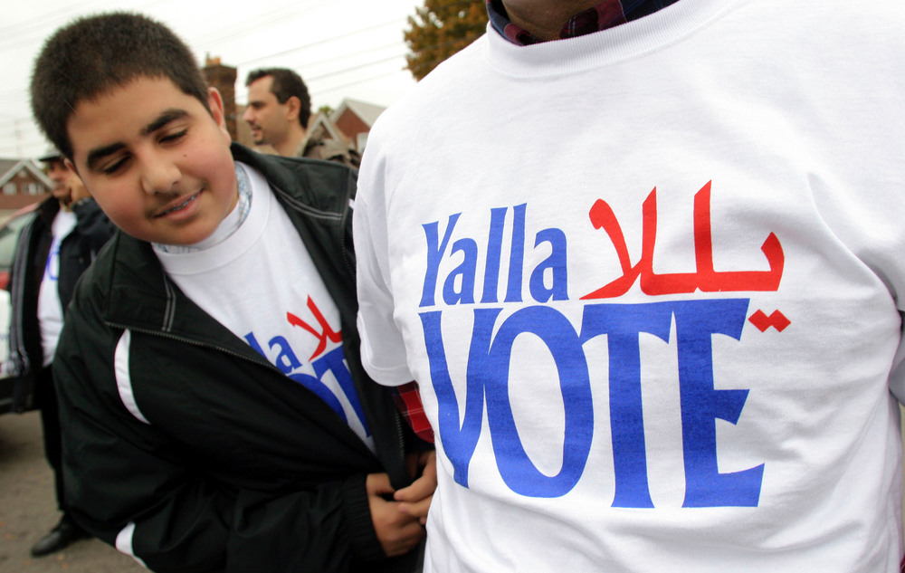 Volunteers take part in a 2004 voter outreach event in Dearborn, Mich., organized by the Arab American Institute. While there is no federal requirement for Arabic-language ballots, the city of Dearborn recently started requiring election materials to be translated into Arabic. (Getty Images)