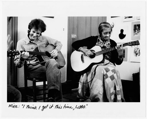 Seeger and Cotten messing around circa 1978; Cotten is playing right-handed and Seeger is playing left-handed.