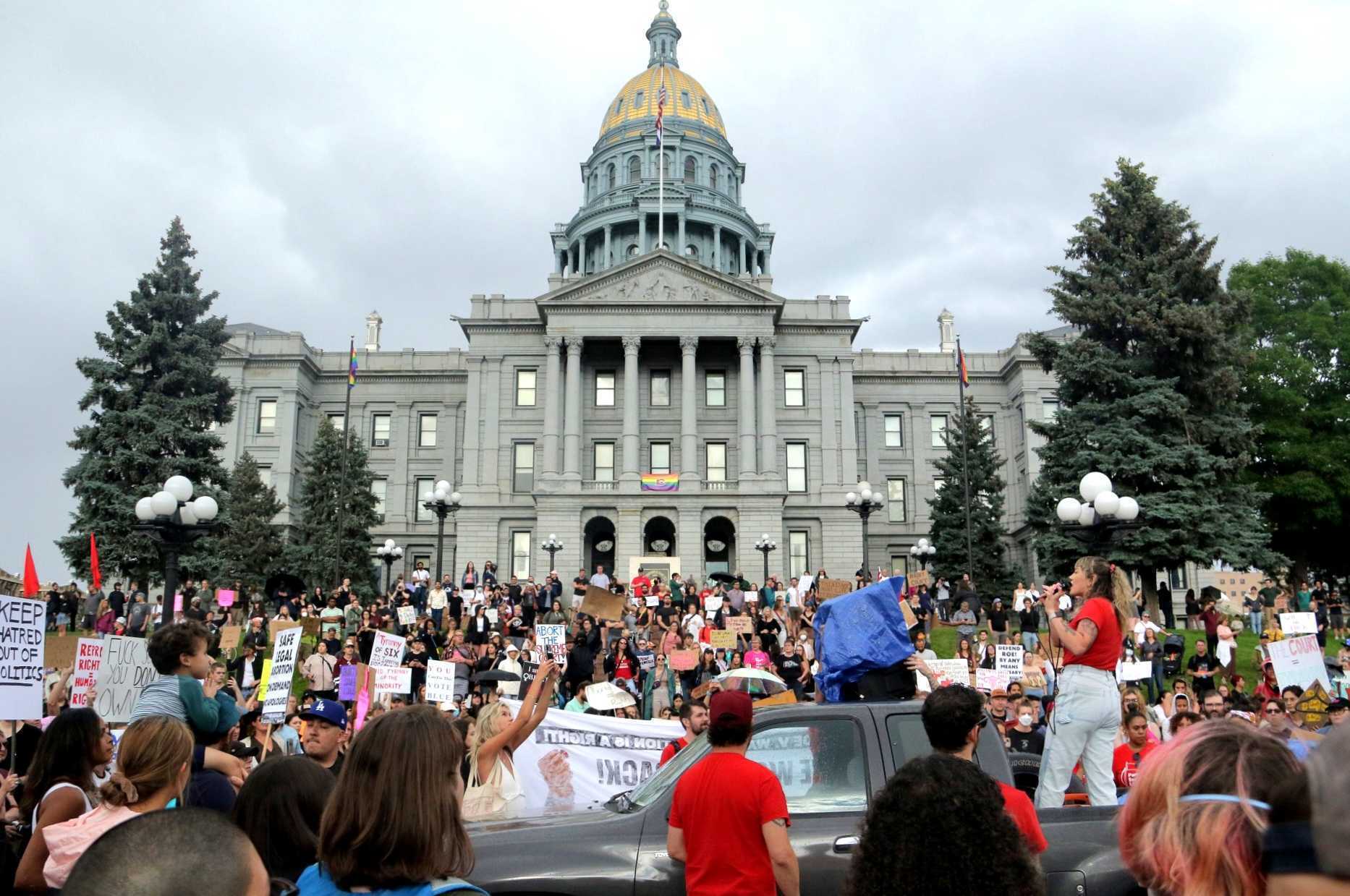 Protesters gather in Denver, Colorado following the Supreme Court decision overturning Roe v Wade.
