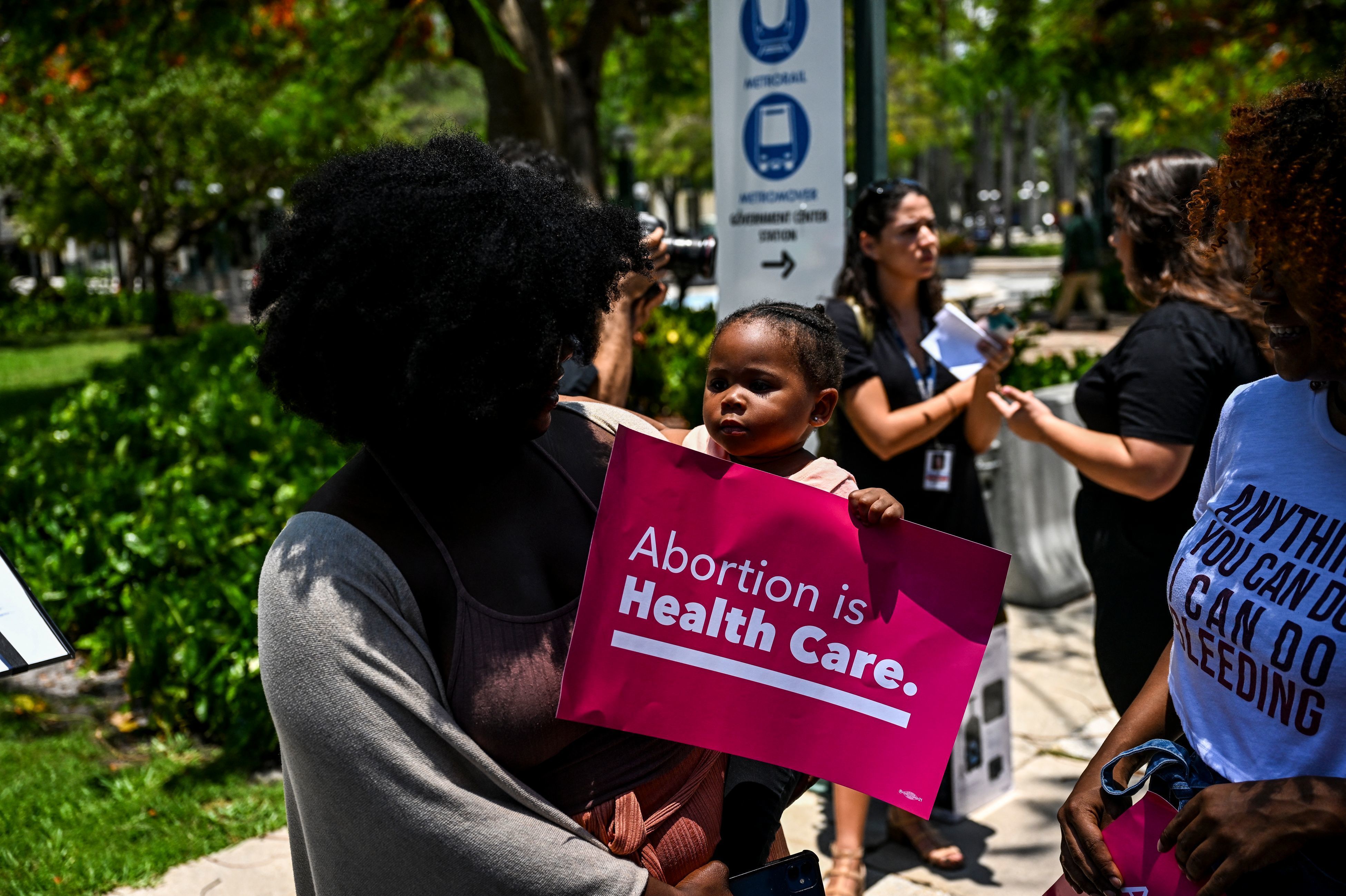 Tifanny Burks holds Novah Smith, 2, during a protest organized by Florida Planned Parenthood after the 6-3 ruling in the Dobbs v. Jackson Women's Health Organization case in Miami, Fla., on Friday.