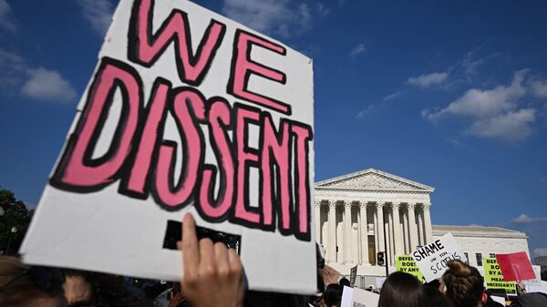 Abortion rights activists rally outside of the U.S. Supreme Court after the overturning of Roe Vs. Wade on Friday. A poll taken after the decision showed 56% disapprove of it.