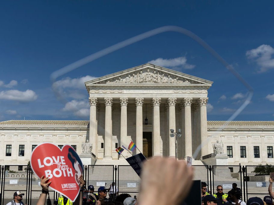 Abortion-rights protesters and anti-abortion protesters gather Sunday outside the U.S. Supreme Court in Washington. (Getty Images)