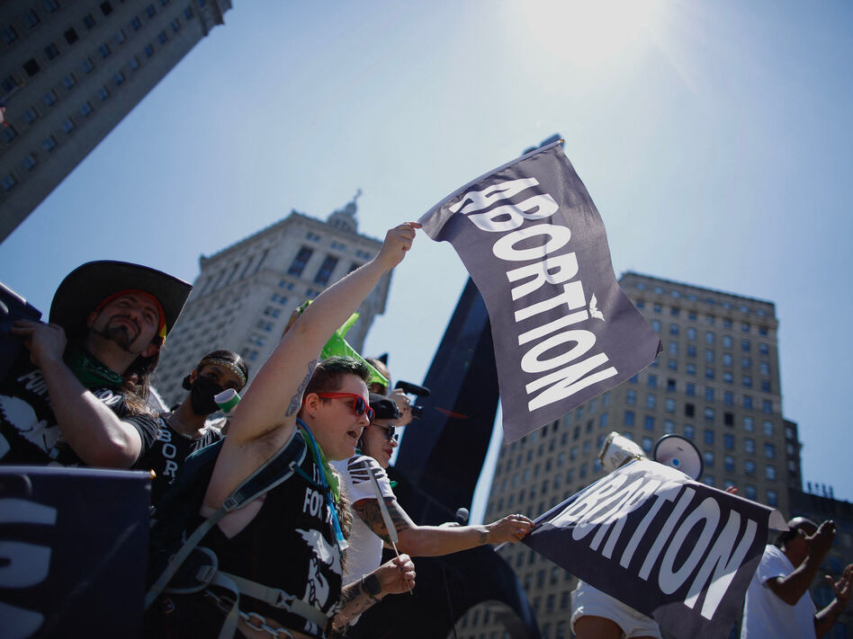 Abortion-rights activists carry flags as they gather to participate in the Queer Liberation march in New York City earlier this week.