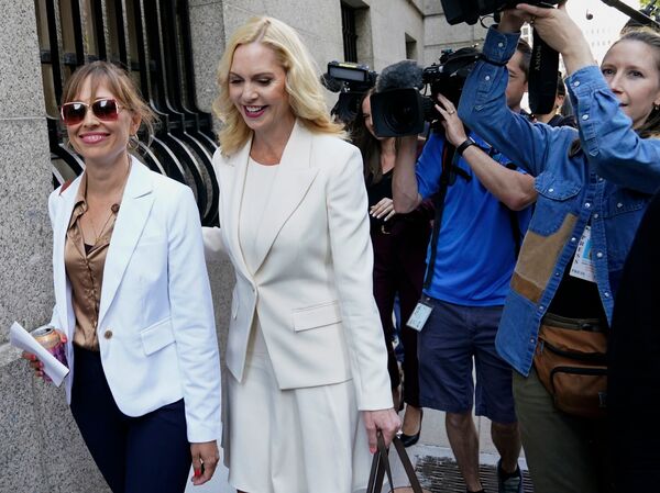 Annie Farmer (left) and her lawyer Sigrid McCawley arrive at US District Court for the Southern District of New York on June 28, 2022, for the sentencing hearing of Ghislaine Maxwell.