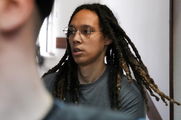 WNBA star and two-time Olympic gold medalist Brittney Griner is escorted to a courtroom for a hearing, in Khimki just outside Moscow, Russia, Monday, June 27, 2022.