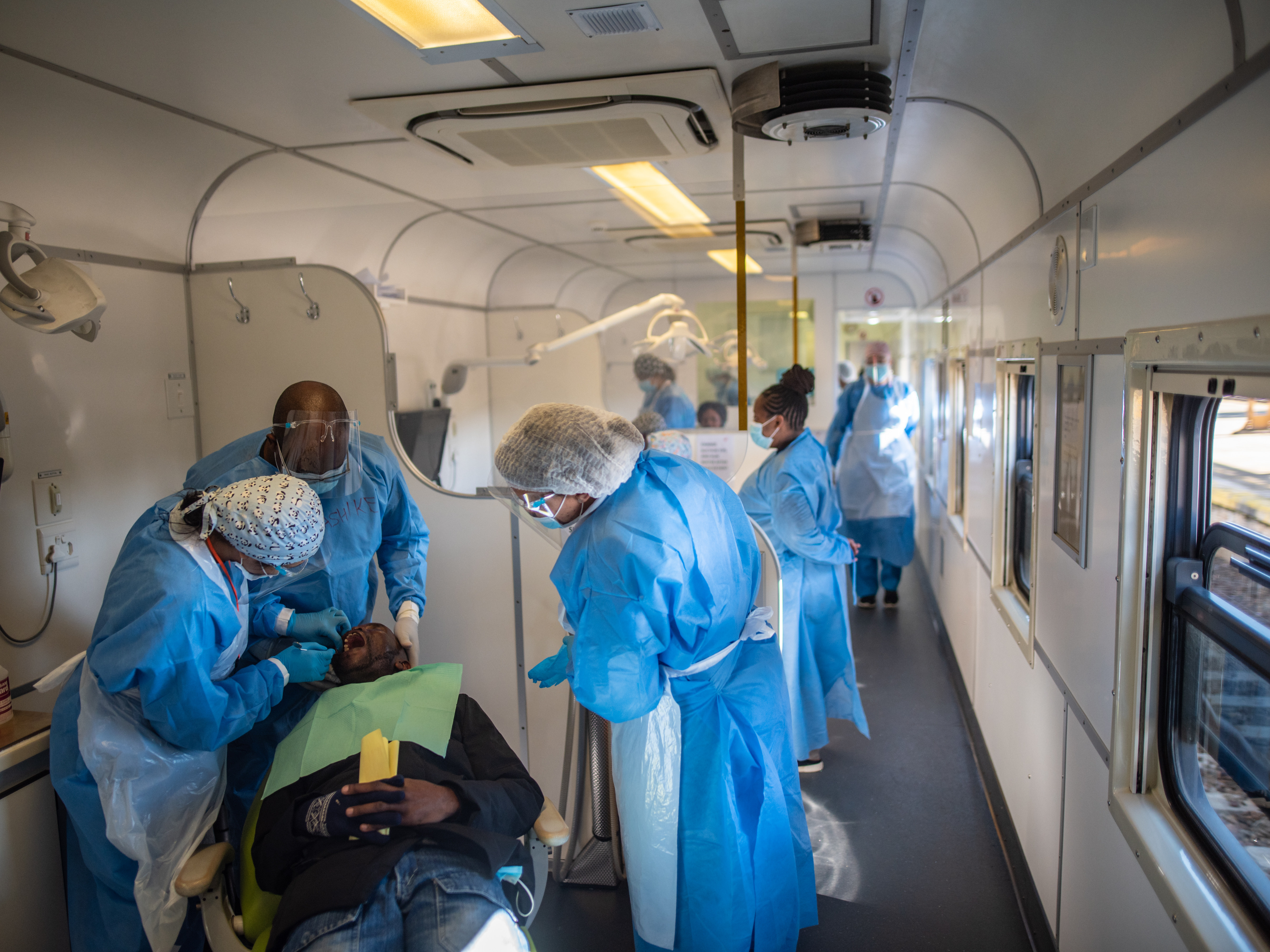 PHOTOS: South Africa's 'train of hope' is a godsend for millions. But new threats loom 7 Health-care workers see to a patient in the dental carriage of the Phelophepa during a stop at Kroonstad in South Africa's Free State province.