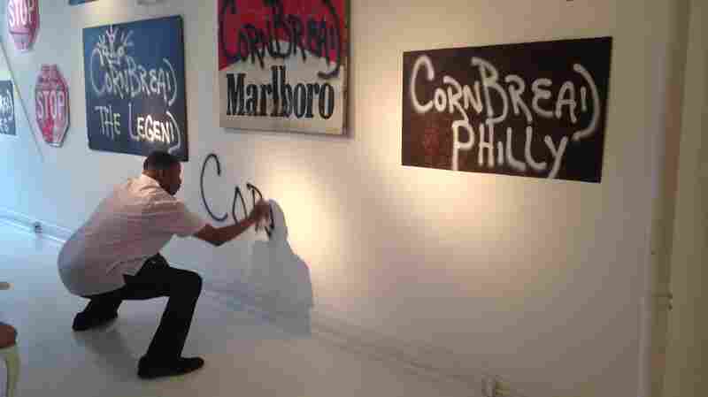 Darryl "Cornbread" McCray tags the wall at Paradigm Gallery in Philadelphia, Pennsylvania