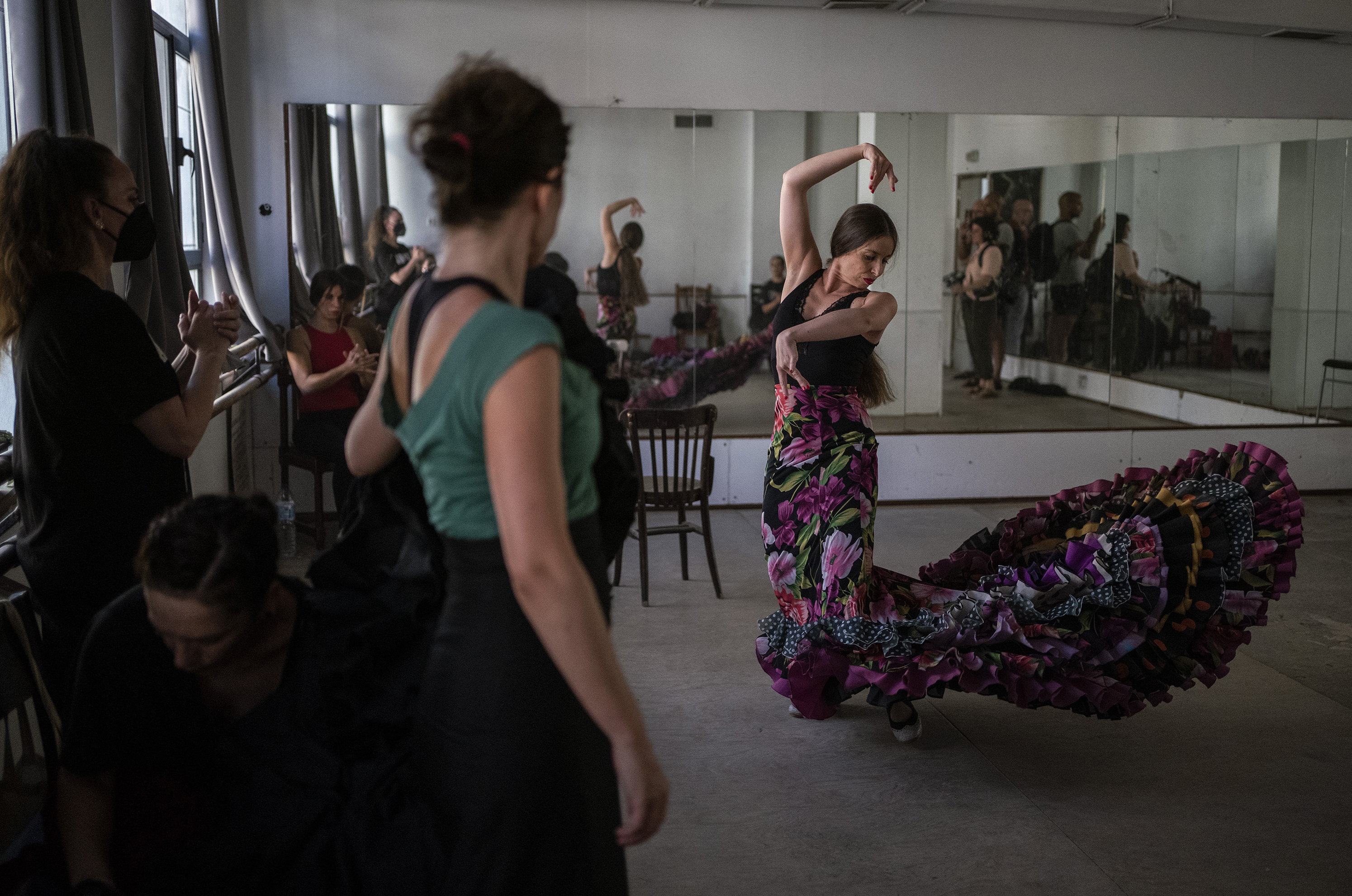 Student at Amor de Dios performs a number with a bata de cola.