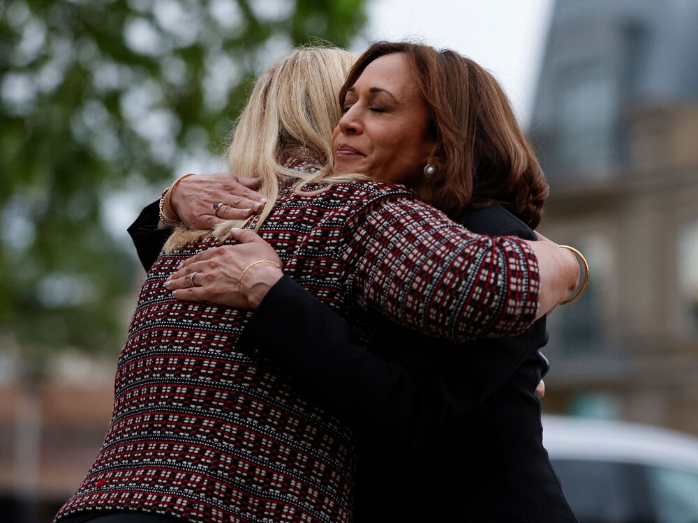Vice President Kamala Harris hugs Highland Park, Ill., Mayor Nancy Rotering on Tuesday as she visits the site of Monday's mass shooting that killed seven people and injured dozens. (AFP via Getty Images)