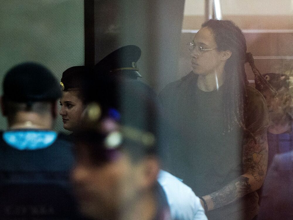 Brittney Griner is escorted to a hearing at the Khimki Court outside Moscow on Thursday for a third hearing in her trial on drug charges. (AFP via Getty Images)